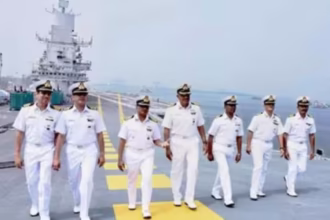 Indian Navy Civilian Recruitment 2025 – Officers standing in uniform aboard a naval ship showcasing discipline and pride